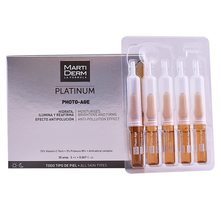 Small glass anti‑age ampoule with clear fluid, vitamin C and hyaluronic formula