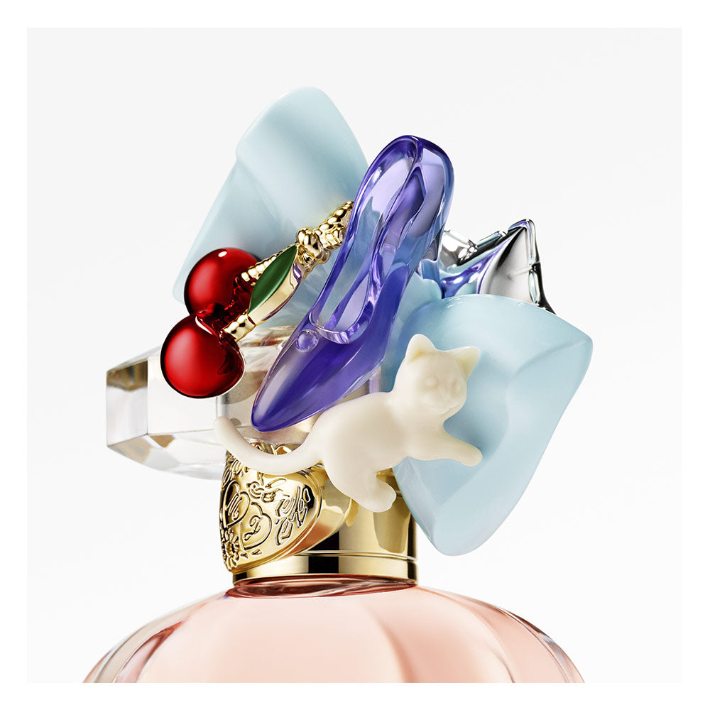 Rounded glass bottle with pink perfume and decorative charms, 50 ml