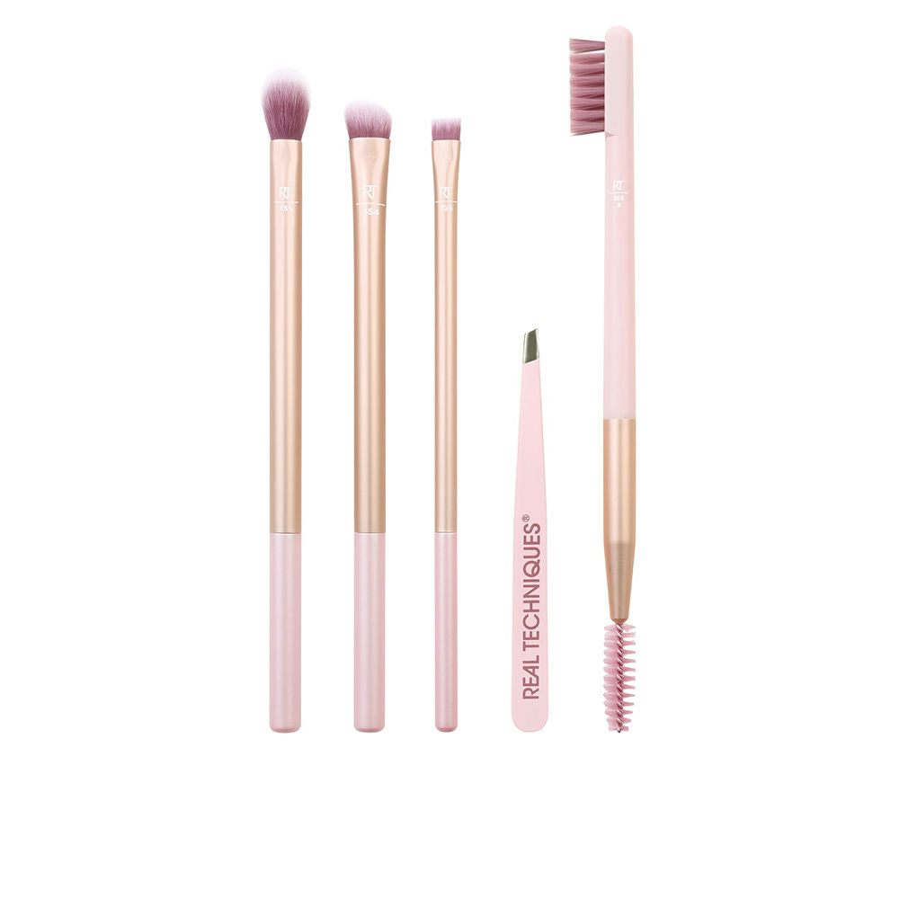 Real Techniques Pink and rose gold makeup brush set with synthetic bristles, varied shapes, angled tweezers