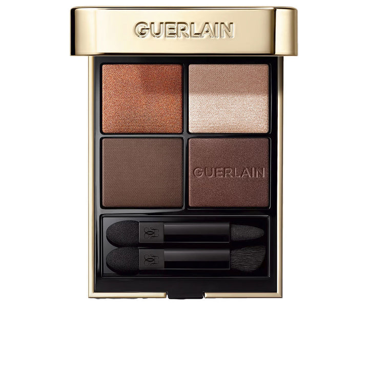 Compact eyeshadow quad in brown neutrals with velvet sleeve and dual applicators