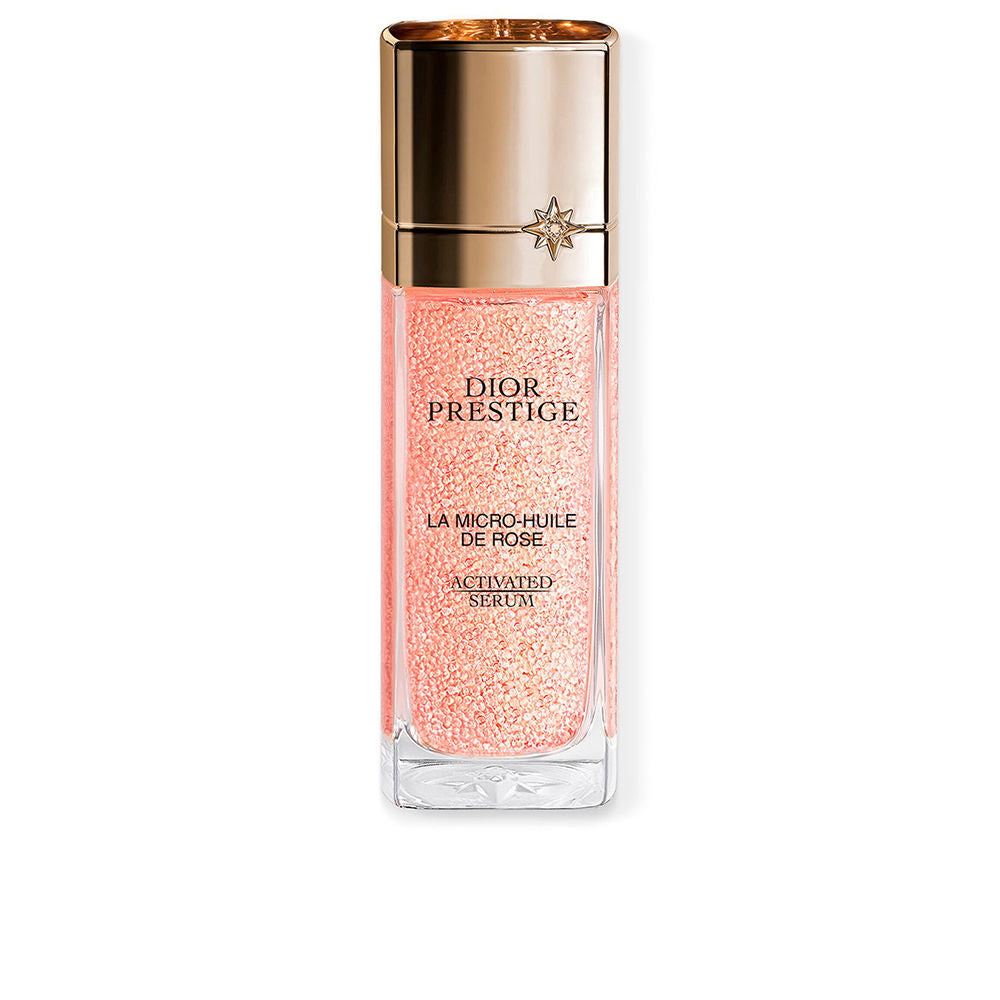 Luxurious glass bottle of Dior rose oil‑serum for face and neck
