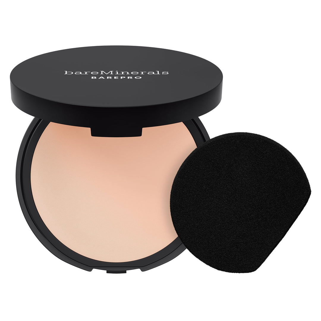 Bare Minerals Pressed powder compact in matte black case, warm beige foundation pan visible, smooth full-coverage surface