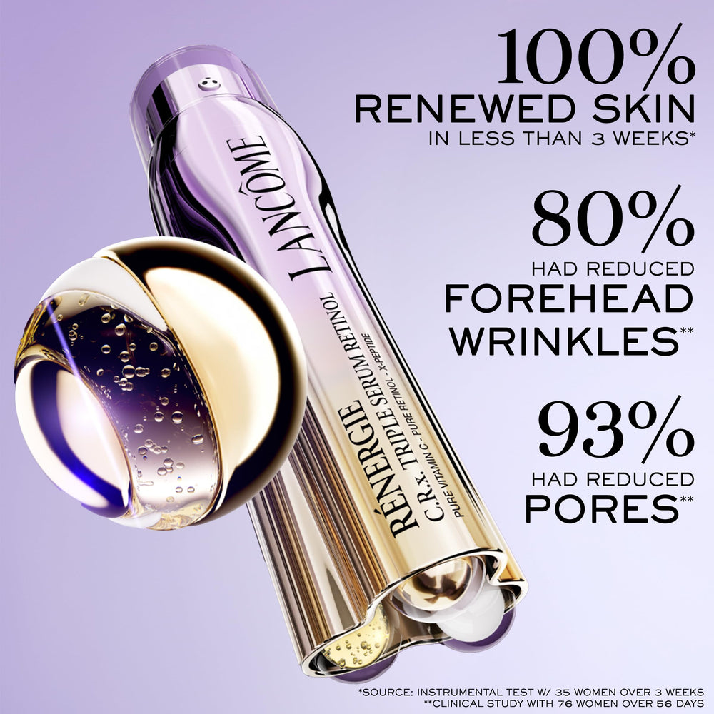 Glass triple‑chamber serum bottle showing clear and amber liquids, polished metallic cap, Lancôme label visible
