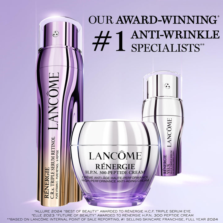Glass triple‑chamber serum bottle showing clear and amber liquids, polished metallic cap, Lancôme label visible