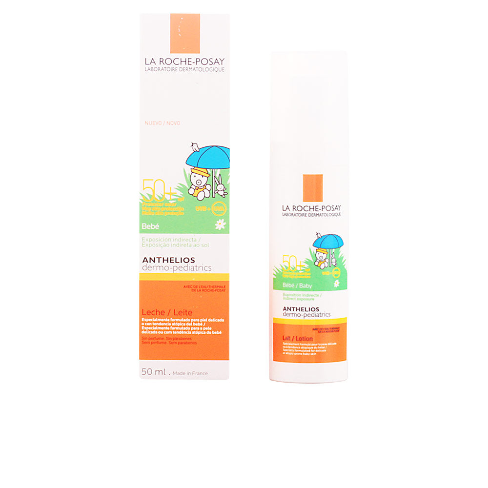 White plastic lotion bottle with orange cap, teddy-bear illustration and blue umbrella, la Roche Posay logo
