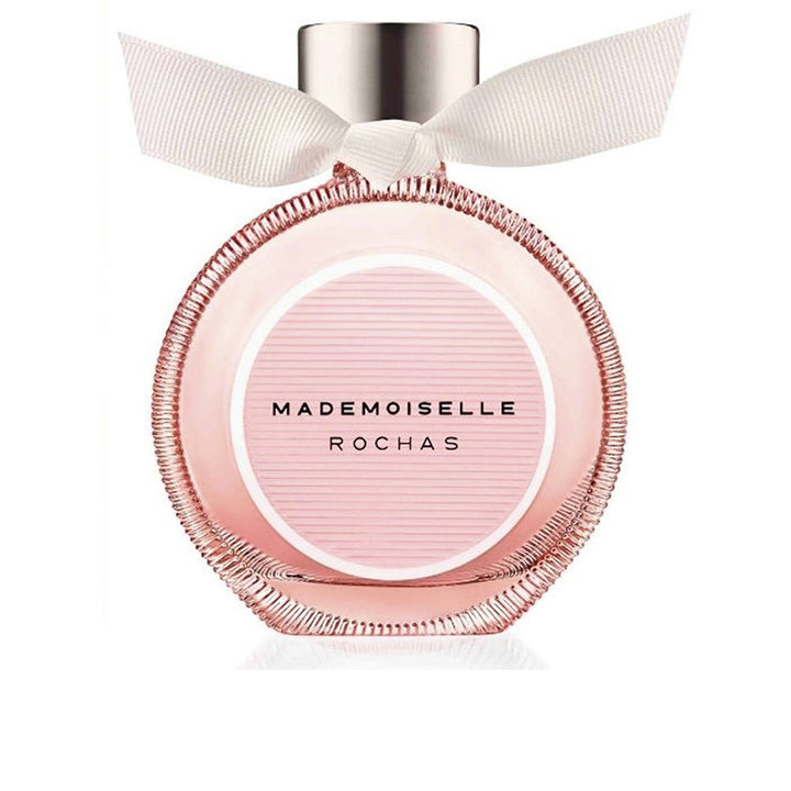 Rochas Glass round pink perfume bottle with metallic cap and white ribbon bow, elegant modern design