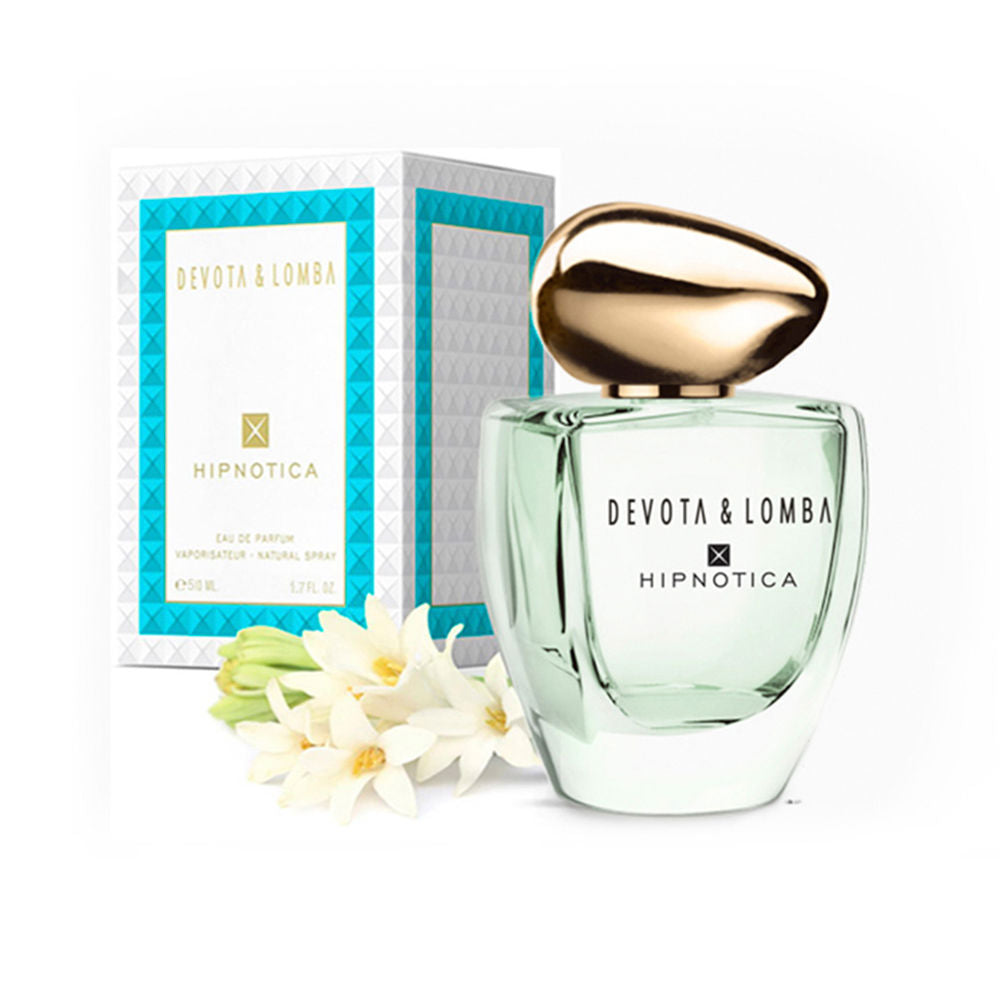 Minimalist white opaque perfume bottle with luxurious gold cap, Hipnotica by Devota & Lomba.