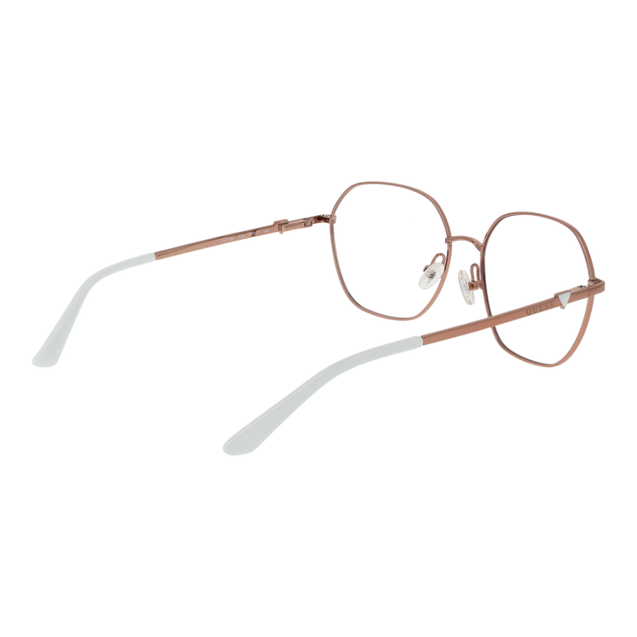 Rose gold hexagonal metal eyeglasses with clear nose pads on white background