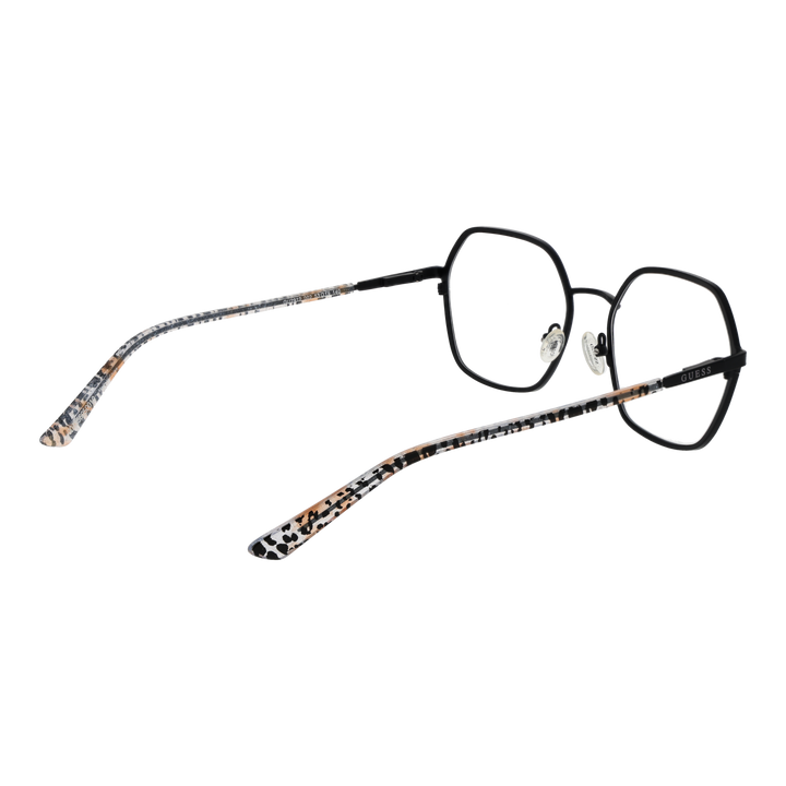 Black metal hexagonal eyeglasses with beige, black, white patterned plastic arms and adjustable nose pads