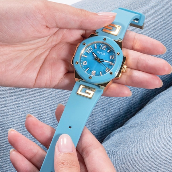 Light blue dial watch with gold accents, stainless steel case and adjustable silicone strap