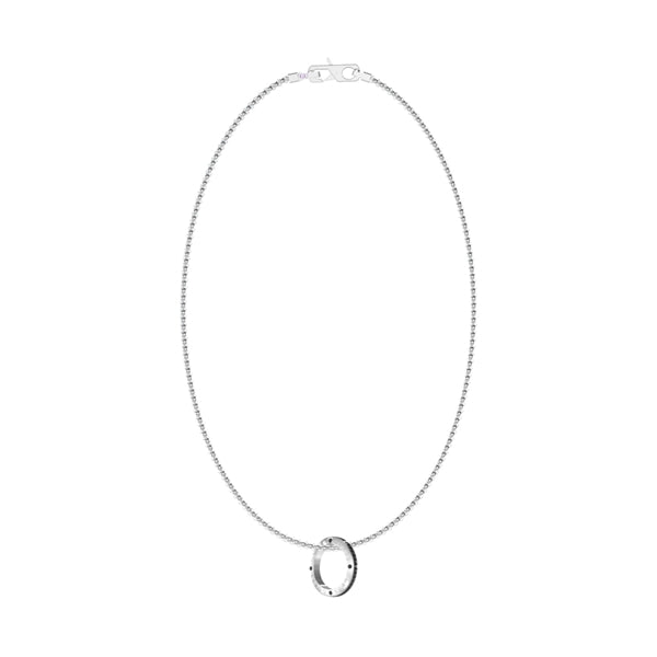 Silver-tone chain necklace with oval pendant on white background, minimalist clasp visible