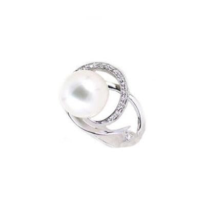 Silver ring with large white pearl center and small pavé stones on a curved polished band
