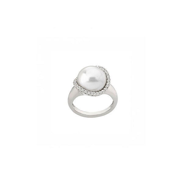 Silver-tone ring with large central white pearl surrounded by small sparkling stones on polished band